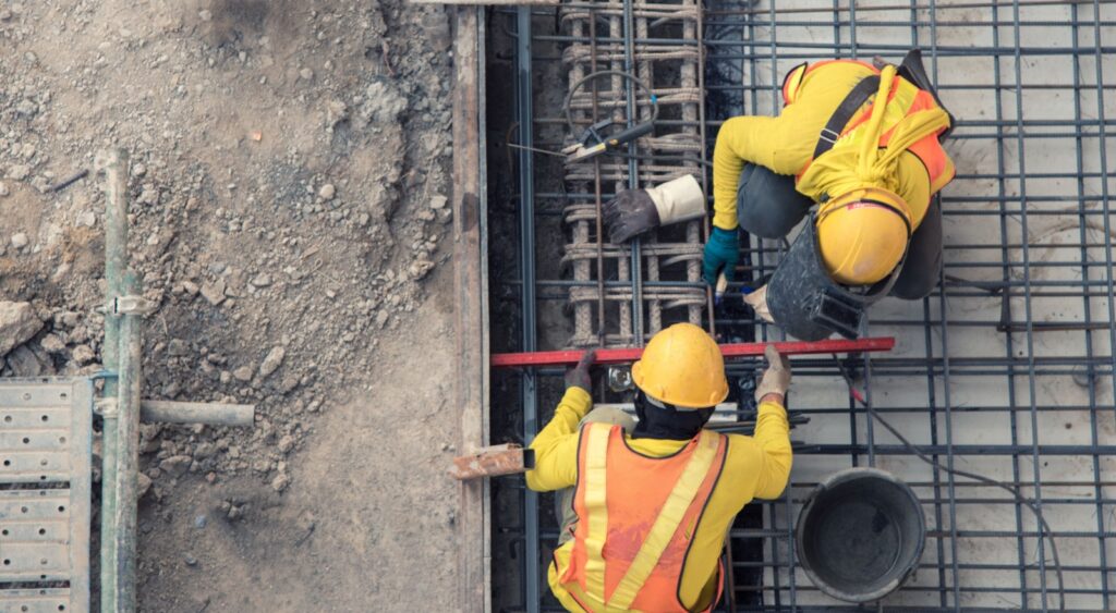 An aerial view of construction workers.