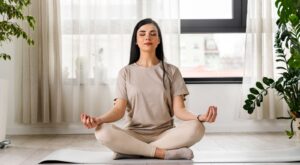 A woman meditating.