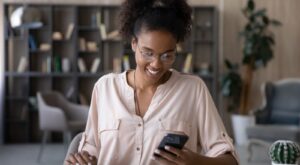 A woman looking at investment performance on her phone.