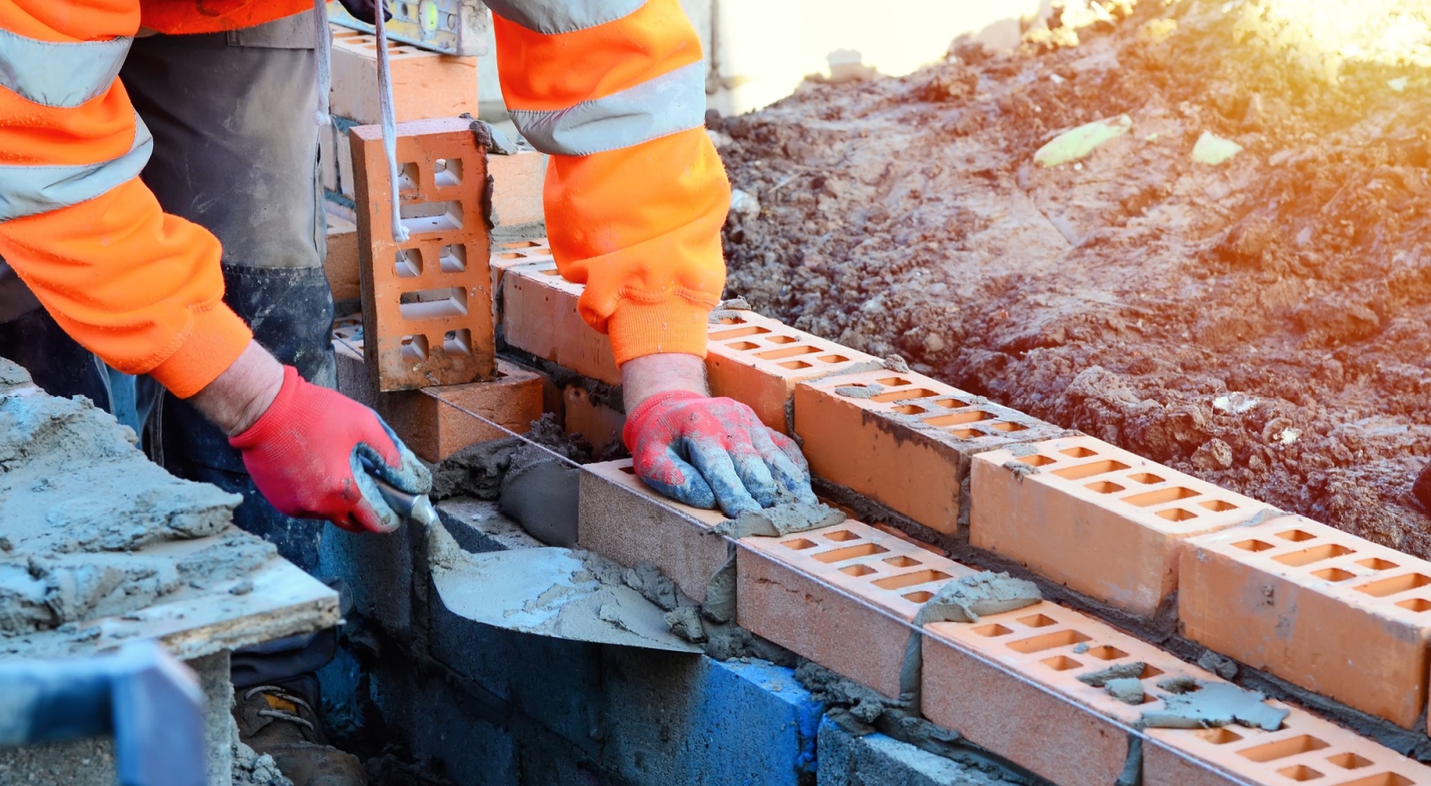 A bricklayer working on a construction site.