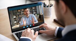 Someone using Zoom to talk to a person.