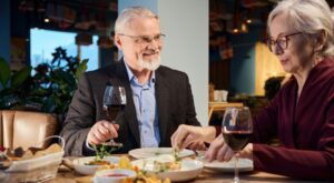 A couple enjoying a meal in a restaurant together.