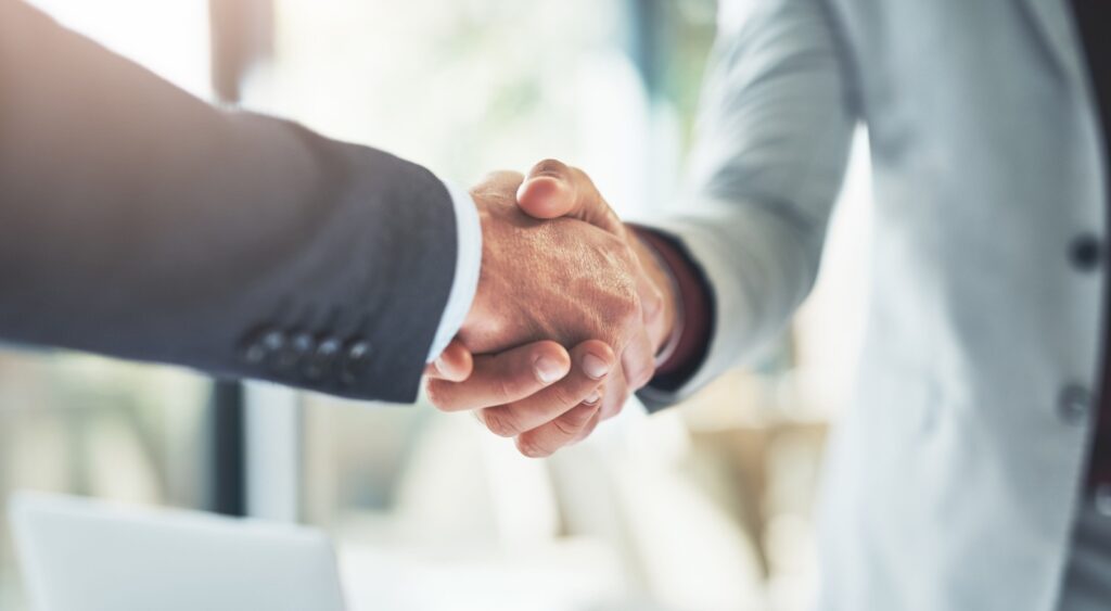 Two people shaking hands.