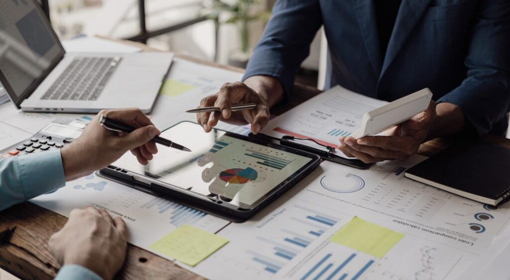 Business people looking at documents in an office.