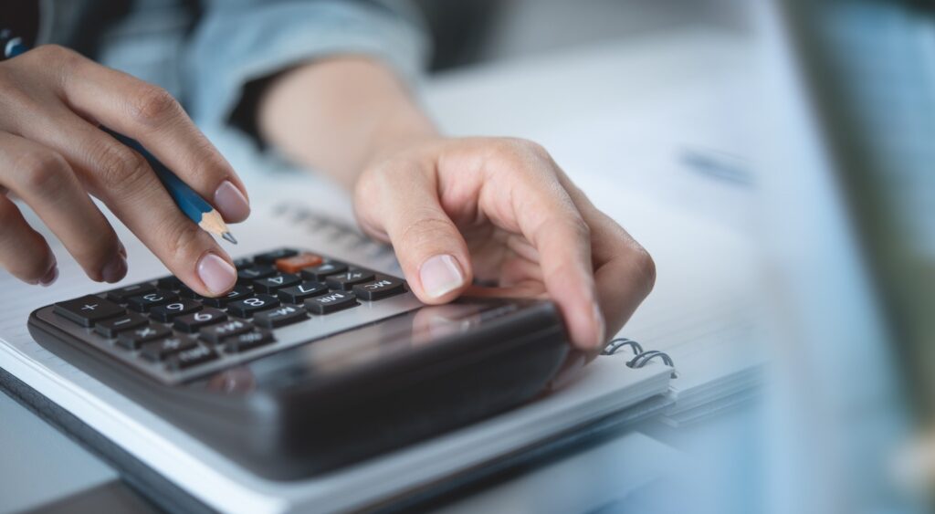A person using a calculator.