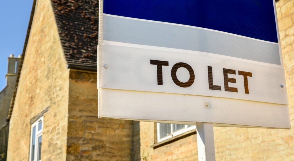 A “to let” sign outside of a home.