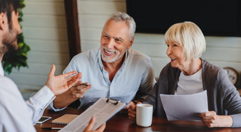 A couple speaking to an adviser.
