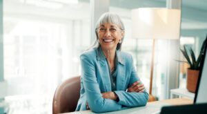 A female business owner sitting at a desk.